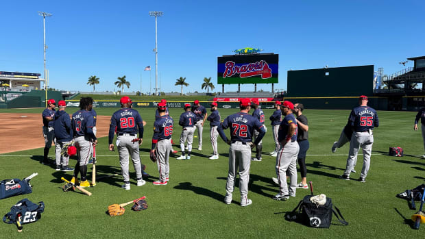 Atlanta Braves gather on the field before starting their spring training workout on Tuesday, Feb. 20, 2024 at CoolToday Park in North Port, Florida.  